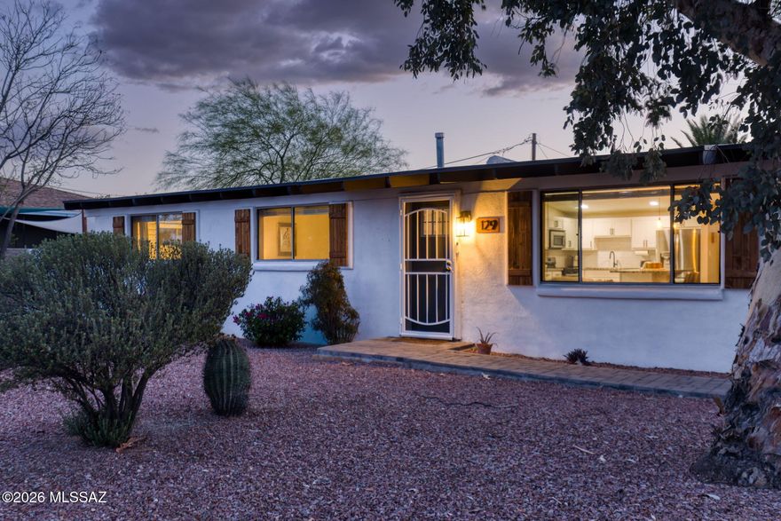 Classic burnt adobe with stucco finish home that doesn't just blend character and modern design- it owns it. Perfectly positioned in the heart of Tucson, this is where style meets strategy. 4-bedroom floor plan featuring a primary bedroom with en-suite bathroom, plus junior suite with full bathroom and 2 more bedrooms plus a full guest bathroom- this home delivers the kind of layout buyers, and investors, are searching for. Inside, the open-concept design brings the living, dining, and kitchen spaces together in a way that feels intentional and functional.The kitchen shows off crisp white cabinetry and a statement island with bar seating. A family room with wood burning fireplace add flexibility, giving you options for guests, work-from-home space, or maximizing rental potential. Every bathroom has been thoughtfully updated with a clean, cohesive look that feels fresh, modern, and move-in ready.
Out back, the opportunity continues. A generously sized lot opens the door to creating something special- pool, lounge spaces, outdoor dining, or the ultimate desert retreat under Tucson's iconic skies. And here's where it gets even more compelling- this home isn't just beautiful; it's proven. With a successful track record as a short term rental, it offers real potential for those looking to step into the rental market or expand their portfolio with confidence. Location matters- and this one delivers. Centrally located with easy access to Tucson's top dining, shopping, and attractions, it's exactly where both homeowners and guests want to be. This is more than a home. It's a smart move, a flexible investment, and a space designed to work for you- now and into the future.