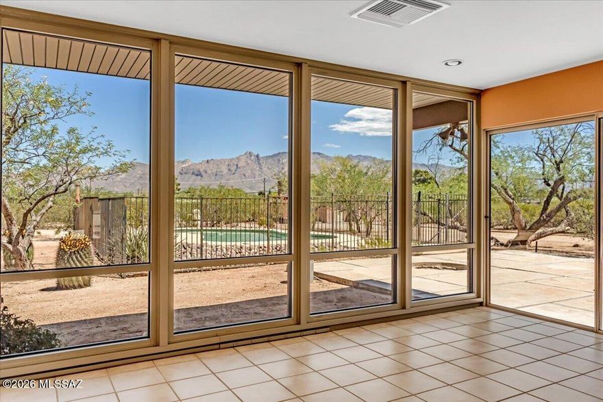 Richland Heights West- Cool Mid-Century vibe, designed by William Cook, built in 1964, this special home has had only two owners. Loads of glass, huge windows, mountain views, tons of natural light, open flowing floorplan, high ceilings, the spacious living area & den/office have walls of glass and expansive views. Huge bonus room/studio. Separate laundry room with additional storage space.  Large flat lot, pool, multiple patios. The Richland Heights West neighborhood is known for its spacious lots, rustic charm, and natural desert landscaping.  The area offers a peaceful, secluded, authentic Tucson feel, yet is centrally located & conveniently close to the University of Arizona, Campbell Corridor, Downtown, The Riverwalk, shopping & restaurants. **Floorplan in pics & ''docs''
