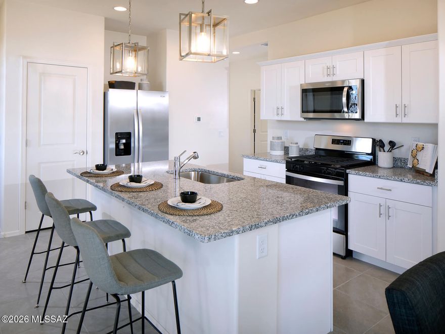 Discover this inviting home with a thoughtfully designed open-concept layout featuring 3 bedrooms and 2 bathrooms. A versatile flex room off the kitchen adds extra space for a home office, playroom, or hobby area. The spacious primary suite includes a generous walk-in closet to fit your entire wardrobe. Located in the growing Mandarina community in Marana, residents will enjoy future amenities like a resort-style pool, pickleball courts, playgrounds, and a dog park. Move-in ready with washer, dryer, refrigerator, and whole-home blinds. Built with energy-efficient features for comfort, savings, and peace of mind.