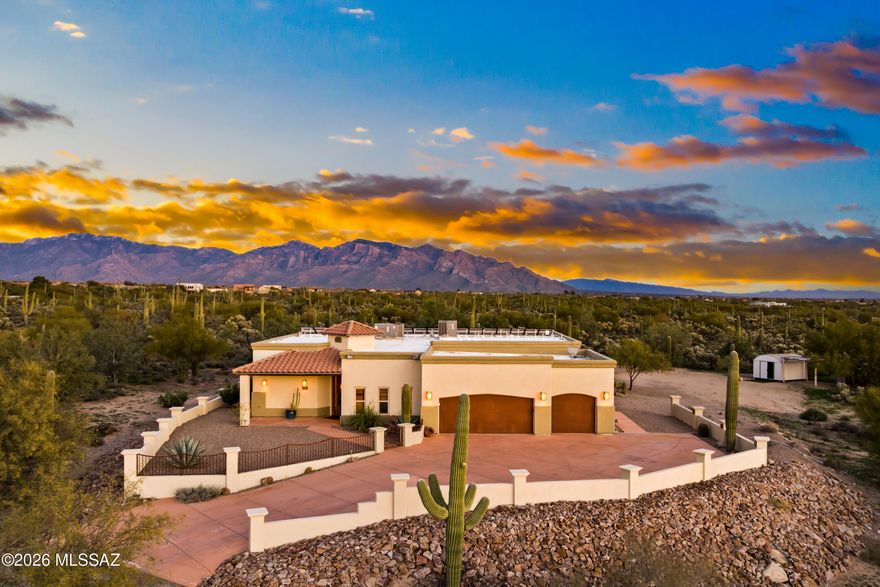An elegant Southwest estate offering a split-bedroom, open-concept floor plan with 4 bedrooms, 3.5 bathrooms, and 3,293 SqFt of living space. Set on an elevated 3.31 acres of pristine desert, the property delivers exceptional privacy, no HOA, and breathtaking 360° Catalina Mountain and desert views. Architectural highlights include barrel-rolled ceilings, solid knotty alder doors, and quality finishes throughout. Recent upgrades include a new HVAC system, exterior repaint, and roof re-coating. A fully paid Tesla solar system and private water well provide impressive efficiency and low utility costs. Outdoor living features a covered pergola with built-in grill. Zoned SR with room for RVs, horses, casita, or expansion. Schedule your private tour and experience elevated desert living!