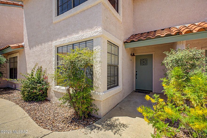 Beautifully updated and spacious home in the highly desirable Tierra De Las Catalinas condominium complex in the Tucson Foothills! Offering over 1,570 sq.ft. of thoughtfully designed living space, this inviting home features 3 bedrooms, 2 bathrooms, soaring vaulted ceilings, neutral two-toned interior paint, modern plank flooring, and a custom fireplace surround. The bright entry welcomes you into a lovely dining area that flows seamlessly into the spacious living room with a cozy fireplace and access to a private covered patio. The kitchen showcases stylish tile countertops, stainless steel appliances, ample cabinet storage, and a charming breakfast nook with additional patio access. Upstairs, the generous primary suite features a private en suite bathroom, large walk-in closet, and beautiful mountain views. Backing to natural open space for added privacy, this home also includes access to outstanding community amenities including a sparkling pool, spa, clubhouse, tennis courts, and fitness center. Conveniently located within School District 16 and just minutes from La Encantada, fine dining, shopping, art galleries, and outdoor recreation. A must see!
