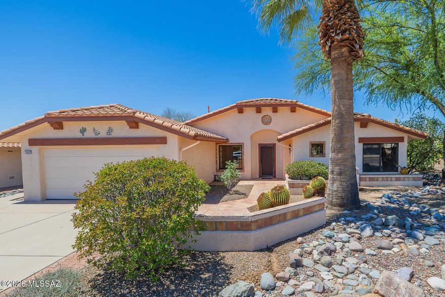 Beautiful home on an exceptional view lot in Sun City Oro Valley. Desirable Cumberland Floor Plan features hardwood floors, spacious greatroom and dining with a cozy gas fireplace. The extended patio has been expanded further to create an inviting large shady space for gracious outdoor Southern Arizona living. The oversized kitchen area include a bay windowed nook that looks out to the stunning Catalina mountains. The spacious primary has a wide bay window looking out to that wonderful patio. Garage features an dedicated area to park your golf cart + 220. This well maintained home has a 1 year old top of the line Lennox heating & cooling system, replaced pipes throughout and a water softening system. This home is move in ready. Golf Cart may be available with a separate bill of sale.