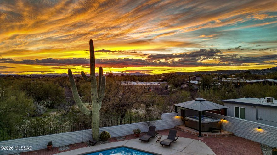 Fully furnished and turnkey - perfect as a primary residence, winter retreat or an Airbnb investment. This move-in ready 4 bedroom/2 bathroom masonry home is sited on a .83 acre lot located in the desirable neighborhood of Rinconada Hills. Nestled within one of Arizona's most breathtaking desert landscapes, this single story home is infused with natural light & nature's beauty while offering many of today's modern conveniences. The open floor plan concept is perfect for today's active lifestyle and features a spacious living and dining area with durable concrete flooring throughout, wood burning fireplace and access to the covered patio. The kitchen features gorgeous quartz countertops, stainless steel appliances, coffee bar, wine refrigerator and plenty of cabinets & counter space.  Retreat to the relaxing primary suite with en-suite which has a large walk-in shower & spacious closet.  Both secondary bedrooms have queen beds. The detached Bunk House offers numerous options: office/art studio/exercise room, and has two twin over full bunk beds as well as two futon sleepers, couch, chairs, dining set and an HVAC mini-split. Enjoy year round entertaining and outdoor dining on the private covered patio with a large heated pool, spa, built-in BBQ grill and multiple outdoor seating areas which allow you to immerse yourself in the beauty of the Sonoran Desert and its lush vegetation, cacti and natural wildlife.  Close to Mt. Lemmon for bike enthusiasts, Sabino Canyon Recreational Center for runners & hikers, Bear Canyon Trailhead, and both Agua Caliente & McDonald Parks.  Resort style living at its best where everyday feels like a vacation!
