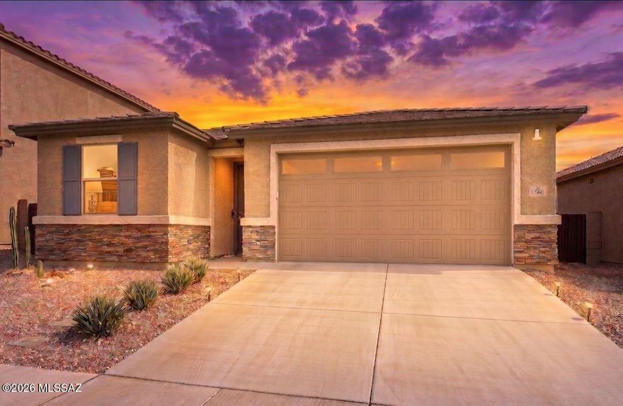 Welcome home to your VA 2.375% (2.42% APR) assumable loan 3 bedroom, 2 bath, 3 car (tandem) garage 2021-built single-story retreat located in the award winning Vail School District. The heart of this home is an inviting kitchen with granite countertops, walk-in pantry and breakfast nook overlooking a spacious great room. The home features three full bedrooms, including a beautiful primary suite with oversized walk-in closet and no carpet. Upgraded tile runs throughout the kitchen and living area. Natural light abounds with an enormous double (four panel) sliding glass door leading to your large covered patio. Dedicated laundry room with both gas and electric connections. Ceiling fans throughout, and 9' ceilings The beautifully landscaped yard is the perfect place to entertain on an Arizona evening, complete with turf for plenty of play and gathering areas on the covered patio. The 3rd bay of the garage is tandem, for either a long vehicle, extra storage, or workout area. Your new home is located in the highly desirable La Estancia community where you will love the great selection of schools available within the sought after Vail School District. La Estancia has direct access to 'The Loop', an interconnected system of more than 135 miles of paved pathways and bike lanes, two community pools, basketball court, pickleball courts, and more than eight beautiful parks. La Estancia is within close proximity to many major employers, including Davis-Monthan AFB, Tucson International Airport, UA Tech Park, Raytheon and Amazon. Come see your gorgeous new home today!