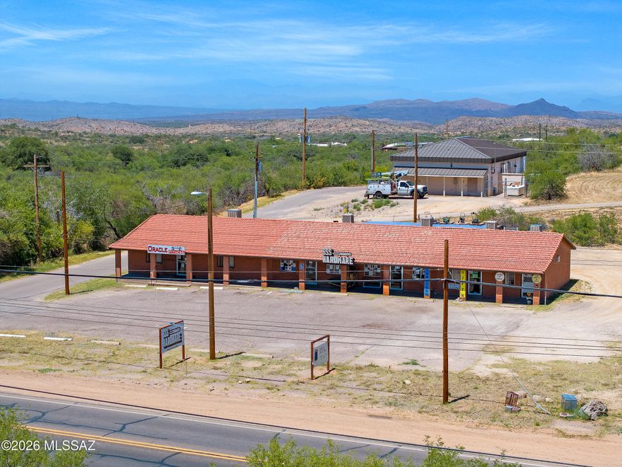 Fully leased multi-tenant retail/commercial investment opportunity in Oracle with stable in-place income and future upside potential. The property consists of approximately 3,060 SF across five individually metered suites with 20 on-site parking spaces and excellent main road frontage offering strong visibility and signage exposure.

Diverse tenant mix includes SSS Hardware Store, local gym, craft retail, & aesthetic services. SSS Hardware occupies Units B & C (1,200 SF combined) with lease secured through mid-2029, providing long-term tenancy stability, while shorter-term leases in remaining suites offer future rental growth opportunities.
• Unit A - 1,200 SF | Gym | $660/month
• Units B & C - 1,200 SF combined | SSS Hardware | $1,000/month | Unit D - 300 SF | $350/month Unit E - 300SF/ $350/moth. More photos on the updated interiors to come. Legal description to convey does not reflect legal description shown on accessors map, Portion of Ray road From lot 10-19 are not part of sale.  Acreage & zoning to be verified.