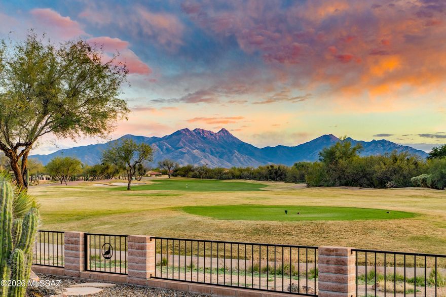 Nestled on a spectacular golf course homesite, this beautifully expanded and upgraded Laredo model captures sweeping fairway views and stunning panoramas of Mt. Wrightson and Mt. Hopkins. Offering 2,284 total square feet, including a 324 sq. ft. private-entry casita, this residence blends timeless architecture with thoughtful upgrades and exceptional indoor-outdoor living. The expanded main house offers 3 bedrooms, one ideally suited as an option den or office; a 2-foot extension to the guest bedroom, guest bath, and den provide added comfort and flexibility. Bay windows in both the owner's suite and main guest bedroom frame picturesque mountain views and invite abundant natural light. The great room is anchored by a custom-designed built-in media wall with gas fireplace and art niches, perfect for displaying collectibles and creating a refined focal point for gathering and entertaining. Custom faux-painted walls provide a warm and elegant, textured backdrop throughout the home. The upgraded kitchen showcases rustic, knotty cherry cabinetry, quartz countertops, stainless steel appliances, center island, pantry, and an adjacent dining area for seamless everyday living and hosting. The owner's suite is a serene retreat featuring breathtaking mountain views, dual vanity bath, a spacious all-tile walk-in shower, and a generous walk-in closet. Ideal for short- or long-term guests, the large private-entry casita includes a full bath, offering comfort and privacy. Outdoor living is exceptional with an end-to-end covered patio, extended paver patio, and dedicated BBQ area all designed to maximize the sweeping golf course setting and dramatic mountain backdrop. Completing the home is a large landry room with full upper cabinets and additional built-in storage, an extended-length 2-car garage with attached cabinets, plus a separate golf cart garage adjacent to the casita. BONUS: New roof scheduled for install on April 6. An extraordinary opportunity to own an expanded residence with private casita on one of Quail Creek's premier view lots.