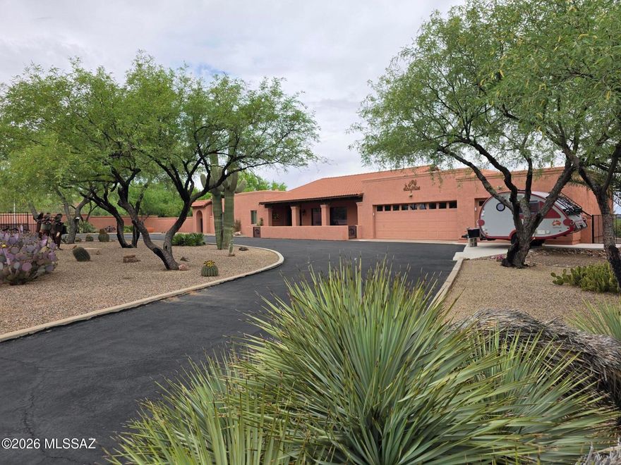 Picturesque home located on the West side of Tubac on 1.43 acres, has 2637 sf of custom home features and views from every room. 2 large bedrooms and an office equipped with a Murphy bed, fireplace and spacious room for guests. Entertain on your large back Covered Patio and enjoy the beautiful Mountain Scenery of Elephant Head and Mt Whipple Observatory. A large kitchen with eat in dining space and Natural Mexican Contera Stone. Formal dining area and great room concept along with 14' vaulted wood beamed ceilings. 3 car garage, 3 gas fed fireplaces NO HOA! Come and see this Gorgeous Southwest Ranch Style home today!