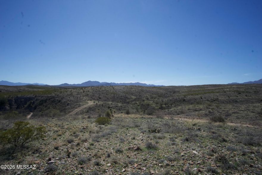 Beautiful 5.42-acre parcel bordering State Land with sweeping desert and mountain views in every direction. This gently rolling property offers multiple ideal build sites, wide-open space, and the privacy buyers are looking for. Enjoy peaceful surroundings away from traffic and congestion while still being just minutes to I-10 via paved Marsh Station Rd and convenient to Vail and Tucson amenities. Electric and phone are available at the lot. There is opportunity to improve the existing well shared with the adjacent parcel to the north. Deed Restrictions require 1,600+ sq ft site-built custom homes only; no manufactured or modular homes permitted. Staked and flagged in 2023. Sellers are licensed real estate agents in the State of Arizona (Owner/Agent).