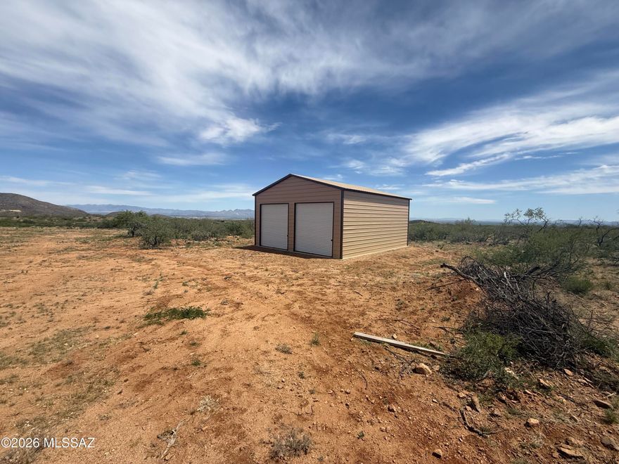 42.86 acres in High Lonesome Ranches with an amazing metal building awaits your custom home! Large view lot with amenities such as a private well and power pedestal on property. Well has been dug but no pump or electricity, power less than 100 yards away to the building and well site. This is the dream home starter kit you've been waiting for! Come bring your horses and toys to this amazing area boasting of some of Cochise county's most interesting history. Close to Historic Tombstone and Gleeson jail, this property has a lot of useable areas for a large home, horse corrals and much more. Explore the high desert just minutes from this property.