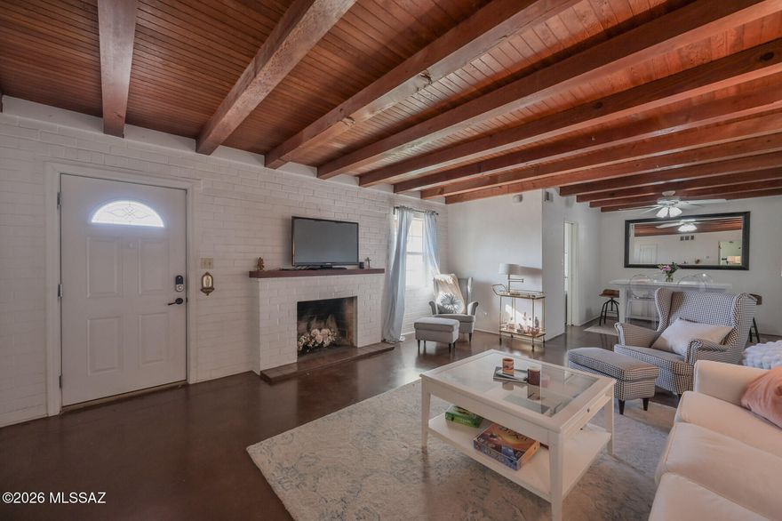 Charming, well located ranch style home complete with separate guest house in the desirable Historic Catalina Vista neighborhood. This ''broad front'' ranch home was designed for casual comfort with a subtle elegance. This home features a free-flowing concept, concrete floors, and tall open beam ceilings that enhance its functional layout. Generous sized rooms along with intricate built-ins. The guest house was built in 2004 and is separately accessed and addressed with its own metering. The private enclosed yard lends itself for entertaining. Close to the UofA, Banner Hospital, Street Car, Bike Path and numerous shops and restaurants along Campbell.