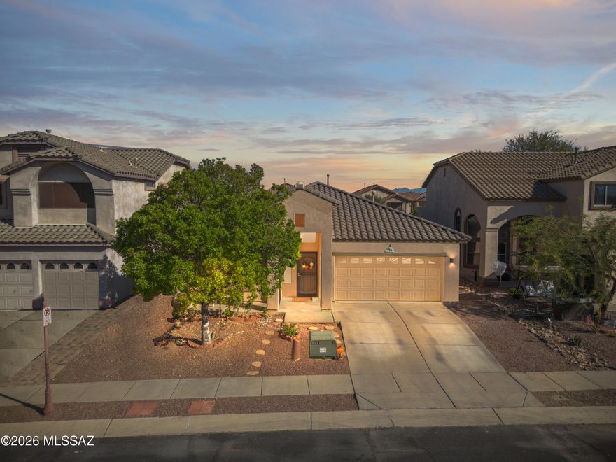 Welcome to this beautiful 3 bedroom 2 bath single-story home located in a highly sought out gated community of Rancho Sahuarita. Ideally situated near Sahuarita Lake, clubhouse, parks, top-rated schools, dining, and shopping, this home offers a perfect blend of comfort, style, and convenience. Step inside to discover soaring high and vaulted ceilings,  tile flooring throughout, fresh new carpet and interior and exterior paint that create a bright and inviting atmosphere. The thoughtfully designed layout features a formal dining room ideal for hosting gatherings, as well as a private office/den perfect for working from home or creating a quiet retreat. The spacious kitchen is designed for both functionality and style, offering stainless steel appliances, abundant cabinetry, a generous walk-in pantry, and expansive countertop space. A charming breakfast nook and built-in desk add to the kitchen's versatility, while the open concept design flows seamlessly into the welcoming family room--perfect for entertaining or everyday living.
The primary suite features a double-door entry, a large walk-in closet, dual vanities, and a bathroom with a soaking tub and separate shower. A guest hallway bathroom with a tub and shower combination provides comfort and convenience for visitors. Step outside to your private backyard retreat complete with a covered patio, fresh epoxy flooring and grassy area--ideal for relaxing evenings, outdoor dining, or weekend gatherings. Additional highlights of the home include a spacious laundry room, a two-car garage, and a prime location.
Experience the lifestyle, beauty, and amenities that make Rancho Sahuarita one of the area's most beloved communities.