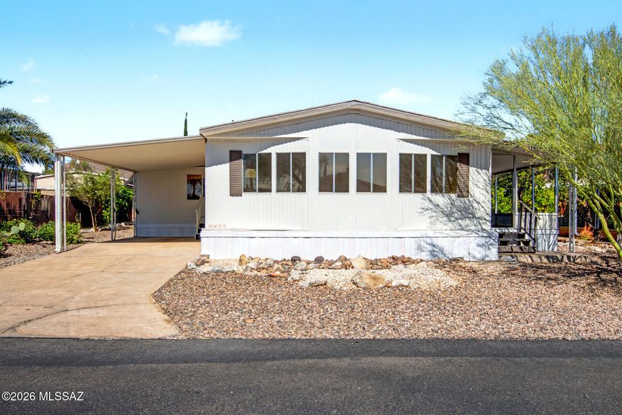 Now Available! Updated manufactured home. Recent upgrades include luxury plank flooring, new carpet, updated electrical fixtures, door hardware, and a brand-new AC.  Kitchen features warm brown cabinets, new countertops, and stainless steel appliances. Interior and exterior updated with fresh paint. Extended covered patio for taking in the beautiful Arizona sunsets. Move-in ready and a must see!