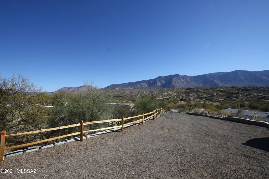 This 3bdr/2ba is located on hilltop w/Stunning mountain views! Open great room w/floor to ceiling sliders brings the outside into your home! Kitchen has counter seating, drop lighting and stainless steel appliances. A covered patio lets you enjoy the reason we live in Tucson! Beautiful tile floors throughout! Hall bath w/vessel sink. Spacious master bathroom w/ensuite offers dual vanity and walk in shower. Minutes to hiking, shopping, restaurants, and more! Fenced side yard w/extra storage. Full size Washer and Dryer. Ample parking allows for trailer. EMS REALTY REPRESENTS THE LANDLORD ONLY ON THIS LISTING
