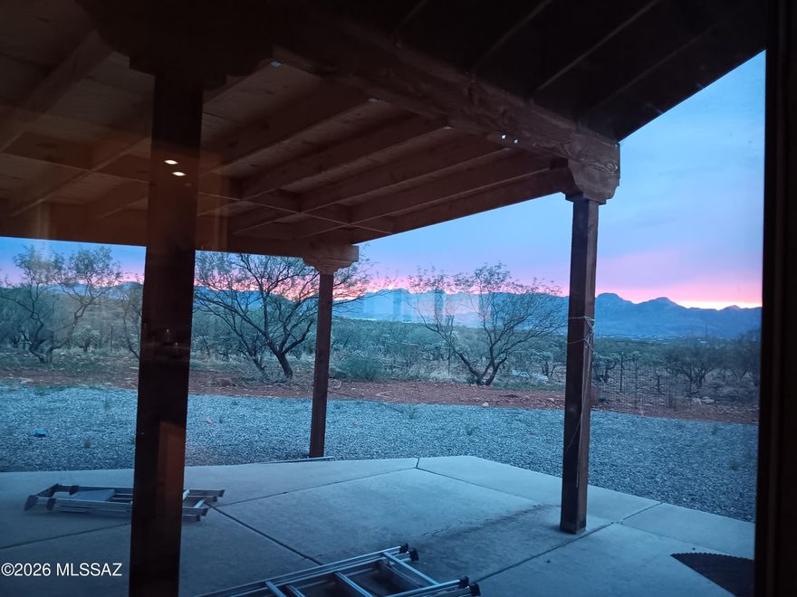 Stunning Panoramic views on 3 prime acres, 3 parcels &A casita, offering Santa Fe Style, custom built, total privacy & serenity with breath taking Sunsets & Sunrises. This immaculate home features soaring 10-12+ft ceilings for an open, spacious feel. Large master with a walk-in closet. Wood burning fireplace. Central A/C& mini-split 24K BTU. Laundry RM inside. A perfect blend of comfort &modern upgrades and jaw-dropping natural beauty,1673 SF & A detached casita 261 SF serves as the private 4th bedroom/guest suite with the 3rd full bath &closet & Spectacular Views-Ideal for visitors, family or extra income, with a separate entry. Whole house water purification &RO in kitchen. High-end blinds.
Relax on covered &Slabbed front & back patios.--Your private mountain escape awaits. East of  I-1