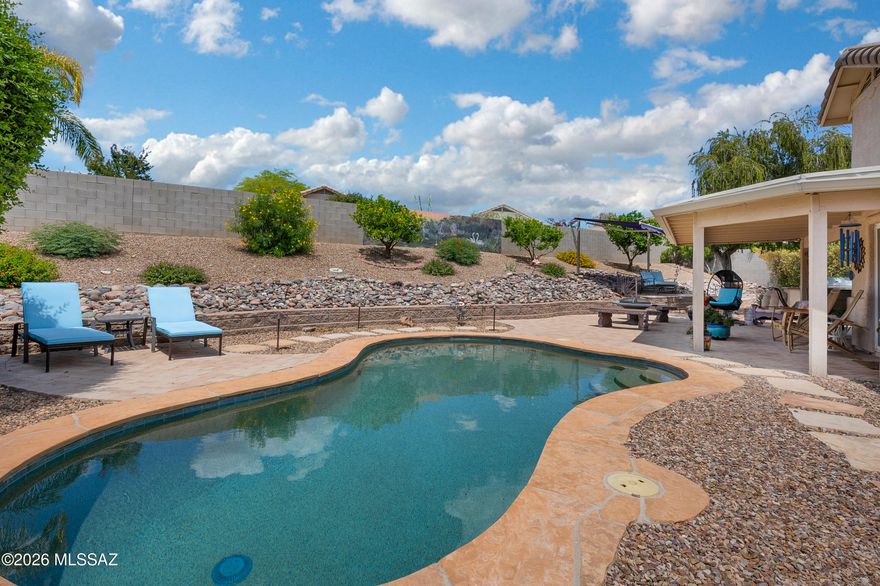 Located on a quiet cul-de-sac in desirable Oro Valley, this beautifully updated 4-bedroom, 2-bath home offers the perfect combination of modern style, comfort, and exceptional outdoor living. Situated on a large lot with an expansive backyard, the property features multiple entertaining spaces designed to enjoy the best of Arizona living. The entire interior has been tastefully remodeled with new flooring, updated cabinetry, and stylish countertops throughout, creating a clean and contemporary feel from the moment you walk in. The spacious floor plan offers generous living areas filled with upscale finishes, while the remodeled kitchen opens seamlessly to the main gathering spaces, making it ideal for both everyday living and entertaining. Step outside to your private backyard retreat complete with a sparkling pool, relaxing hot tub, and several inviting areas for outdoor dining, lounging, and hosting guests. The oversized cul-de-sac lot provides privacy, room to play, and plenty of space to enjoy the outdoors. With absolutely nothing left to do but move in, this turnkey Oro Valley home is ready for its next owner to enjoy. Conveniently located near parks, shopping, dining, and top-rated schools, this property truly has it all.