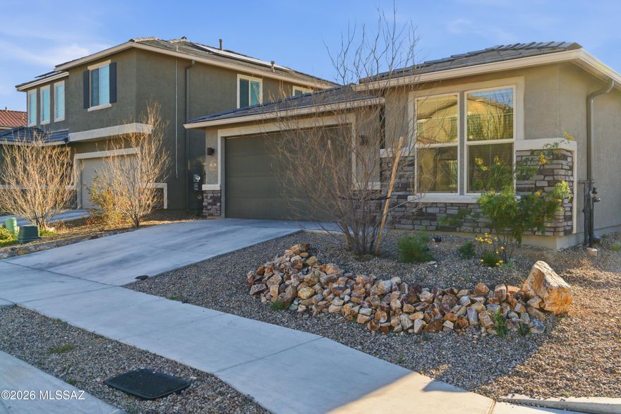 4-bedroom, 2-bath home plus a versatile den/office on a premium corner lot in Rancho del Lago within the Vail School District! This lightly lived-in 2022 Richmond American property offers a bright open great room with 9-foot ceilings flowing into a spacious kitchen featuring quartz countertops, a large island, and walk-in pantry, perfect for entertaining or everyday living. The private primary suite includes two walk-in closets and an attached bath. Enjoy the low-maintenance backyard with turf, decorative gravel, fire pit, and covered patio, ideal for relaxing and taking in Arizona sunsets. Conveniently located near Rancho del Lago Golf Club, parks, walking paths, shopping, and schools. Come see this beautiful home today!