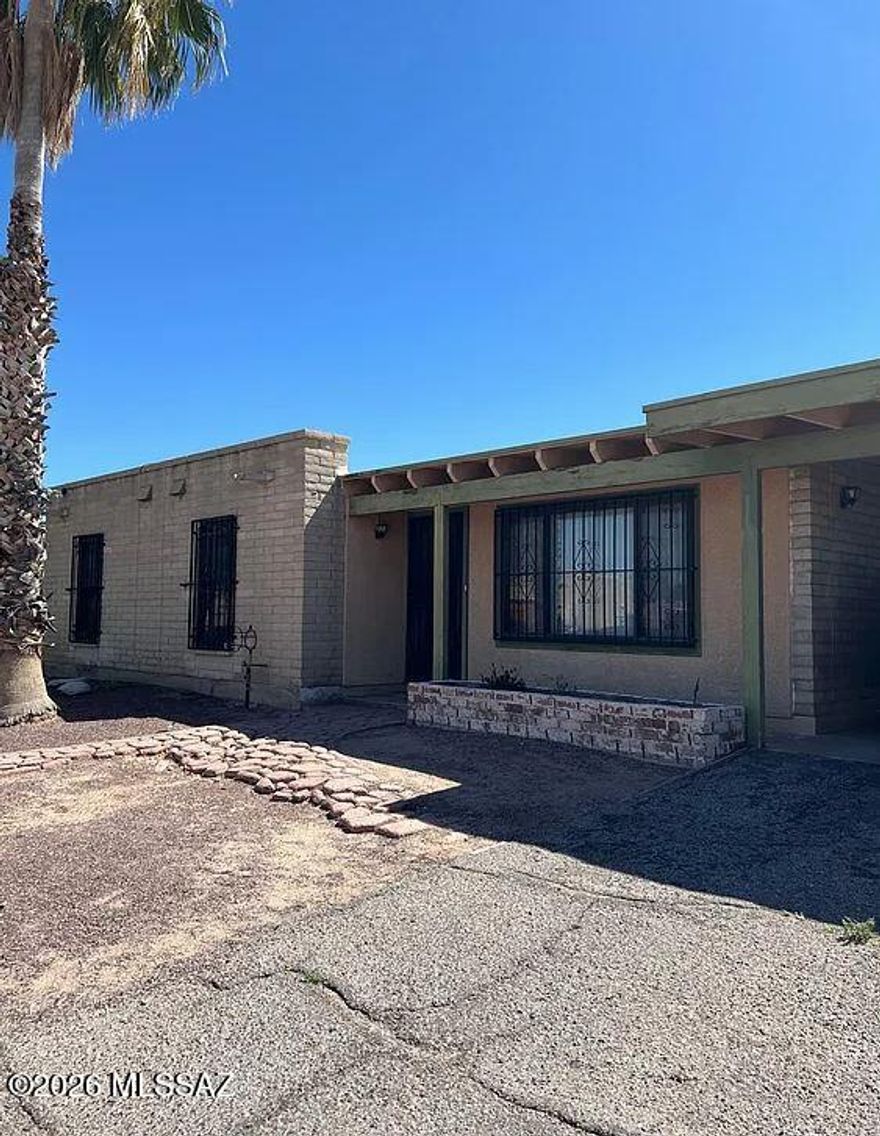 Spacious 4 bedroom, 2 bathroom home offering 1,377 sq. ft. of comfortable living space in south Tucson, conveniently located just down the street from Sunnyside High School. This home features tile and wood laminate flooring throughout with no carpet, creating a clean and low-maintenance interior. The large open kitchen is perfect for everyday living and entertaining, complete with a refrigerator, stove, oven, microwave, dishwasher, and disposal. Enjoy year-round comfort with air conditioning, ceiling fans, and heating. Additional features include washer and dryer hookups, window coverings, a covered carport, and a private fenced yard with plenty of outdoor space. Conveniently located near schools, parks, shopping, and major roadways, this is a pet-friendly home.