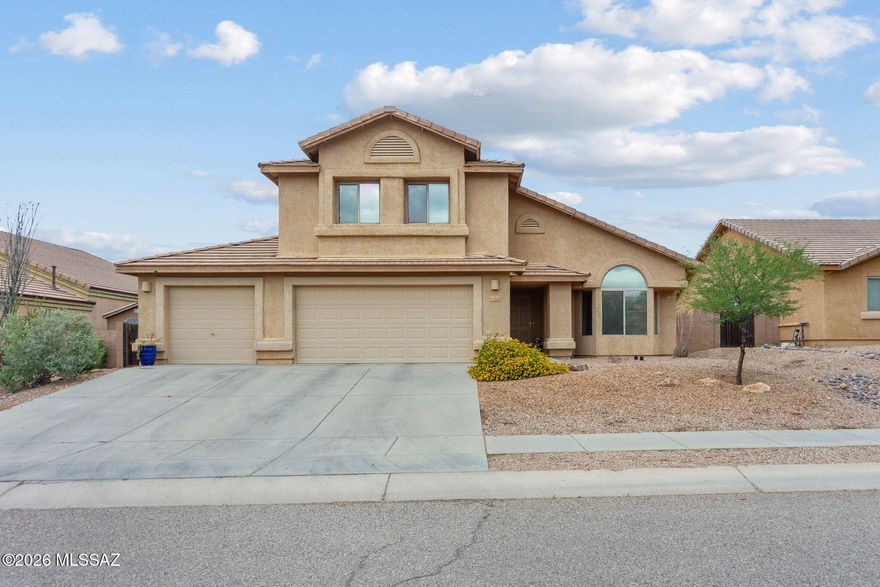 Range Priced $420,000-$460,000.  FULLY ASSUMABLE LOAN-ASK AGENT FOR DETAILS. Beautiful & spacious two-story home in Corona de Tucson, located within the highly sought-after Vail School District. This 5-bedroom, 3-bath home offers a versatile layout with one bedroom and a full bathroom downstairs--ideal for guests, multi-generational living, or an office/gym. Inside, enjoy multiple living spaces including a welcoming family room, separate living room, dining area, and a beautiful kitchen with ample cabinetry and breakfast bar. New 2023 AC units and tankless water heater give you efficiency and peace of mind! The backyard is thoughtfully finished with natural grass, a greenhouse, flower beds, a fire pit area, and a cowboy pool with custom lounge chairs, perfect for relaxing or entertaining.