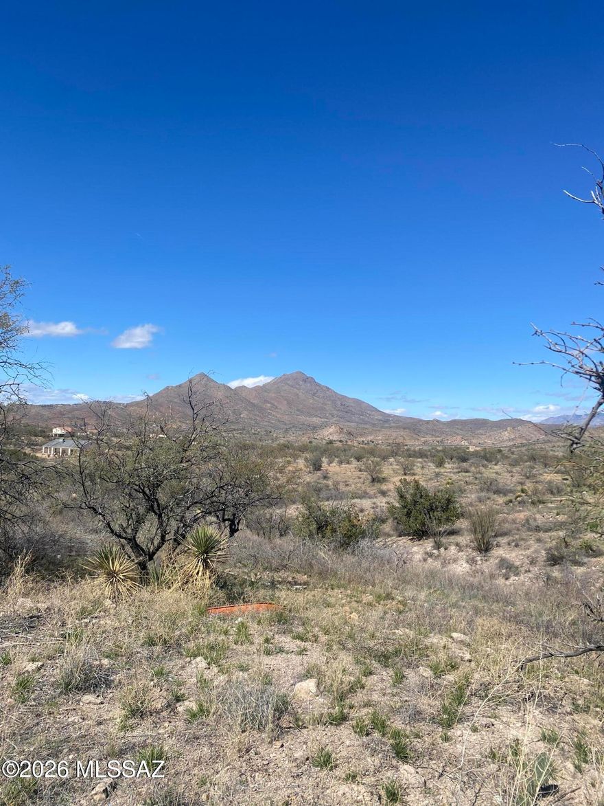 Nestled on a hill top with fantastic MOUNTAIN VIEWS, this is a very buildable lot with utilities at the road.