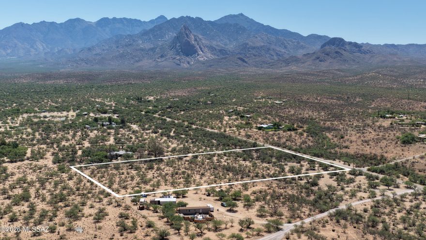 Tucked away in a peaceful rural setting, this stunning 4.9-acre parcel offers the perfect blend of privacy, natural beauty, and convenience. Located adjacent to a paved road with utilities available at the property line, including electricity, water, and phone hookups at the northwest corner, this mostly flat property provides endless possibilities for your dream home, guest house, shop, or hobby retreat. Multiple ideal building sites capture breathtaking panoramic views of Elephant Head and the majestic Santa Rita Mountains. Nature lovers will appreciate the incredible abundance of wildlife and birdwatching opportunities right outside their door. Deer, javelina, bobcats, quail, nesting owls, hawks, hummingbirds, eagles, rabbits, and countless migratory birds are frequent visitors to this serene desert landscape. Seasonal wildflowers and vibrant cactus blooms, including rare and endangered species, create spectacular color throughout the year.
The property is dotted with hundreds of mature mesquite trees, offering shade, beauty, privacy, and a valuable source of high-quality firewood. Customize your own private driveway access from Dove Way and create the ideal desert retreat surrounded by the beauty of Southern Arizona. Well details are available upon request.