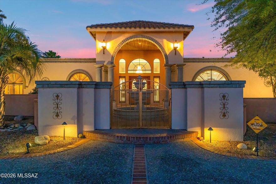 Your Own Private World in the Desert! Set on 8.05 acres, this exceptional estate offers privacy, scale, and versatility--now with a more open, intentional landscape that highlights the home and surrounding mountain views. Enter through the gated drive and experience a property that has been thoughtfully refined. The vegetation has been selectively reduced to create cleaner sightlines, bringing the architecture forward while enhancing natural light and long-range views. The 5,102 sq ft custom masonry home with metal interior framing delivers both durability and thoughtful design. Inside, you'll find 5 bedrooms (including flexible gym/office spaces) and 5 bathrooms, plus a dedicated exterior pool bath. The expansive great room with 12' ceilings connects seamlessly to a well-appointed kitchen featuring granite countertops, a large island with wine fridge, and premium appliances including Viking range/ovens and Sub-Zero refrigeration.
Additional living spaces include a formal dining room and a spacious game/rec room with built-ins, wet bar, and beverage refrigerator--ideal for entertaining.
Outdoors, the property is designed for enjoyment without excess upkeep. The backyard features a pebble tec saltwater pool and spa, extended covered patio, outdoor kitchen, gazebo, and half-court basketball area. A dedicated pet space with direct access from the primary suite adds everyday convenience.
The 765 sq ft detached guest villa offers a full 1 bed / 1 bath layout with kitchen, quality finishes, and a private courtyard complete with fire pit, BBQ area, and covered seating. A spiral staircase leads to a rooftop deck with sweeping sunset and mountain views.
For those needing space for vehicles, equipment, or hobbies, the property includes a 3-car attached garage plus a separate 4-car/RV garage and workshop equipped with a car lift and air compressor. 
A rare combination of scale, function, and refined presentation ready for you!