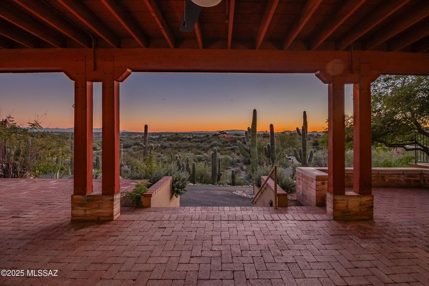 Perched at the top of 3.44 divisible acres with an impressive saguaro cactus grove along the hillside, this burnt adobe masonry home offers magnificent sunrise, sunset, city, and mountain views. This property features 2,106 square feet of living area with 3-bedrooms and 2-full-bathrooms, a spacious kitchen that opens onto the family room and the beehive fireplace. The separate living room and formal dining offer breathtaking views of the Tucson valley and the mountains beyond. A sprawling outdoor living space spans the full length of the home and offers covered patio, open deck, and a beautiful fenced-in pool.
