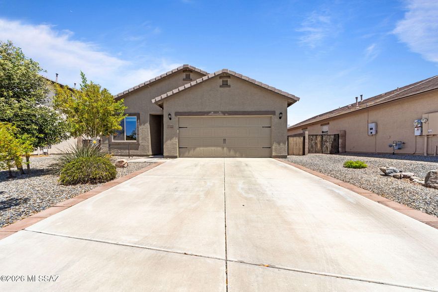 Discover this beautifully cared-for home packed with unique upgrades! Enjoy elegant tile floors that flow through most of the house and stunning granite countertops  that make the kitchen a true centerpiece. The spacious, open floorplan creates a seamless flow between living spaces, perfect for gatherings or relaxing evenings. Step outside to your own private oasis--the backyard is expertly landscaped to provide a serene retreat. Plus, abundant storage solutions help keep everything organized and clutter-free. Located just off I-10, this home offers easy access to city life while being steps from a peaceful park, scenic walking trails, and a friendly dog park. It's the perfect blend of comfort, style, and convenience!
