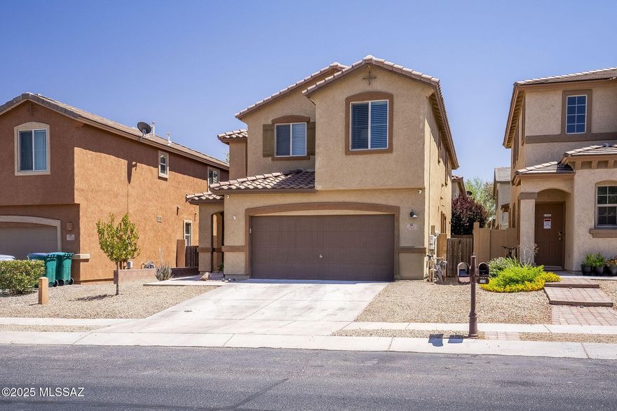Welcome to this beautiful two-story home in the highly sought-after community of Rancho Sahuarita, where comfort and lifestyle come together. Featuring 4 bedrooms and 3 bathrooms, this thoughtfully updated home offers plenty of room for growing families, guests, or multi-generational living. The spacious kitchen is perfect for gathering, with ample counter space and a walk-in pantry to support busy family life. Natural light fills the home, creating a bright and welcoming atmosphere throughout. With multiple living spaces and generous bedrooms, there's truly room for everyone to relax, play, and unwind. Located just moments from community pools, a fitness center, walking trails, and numerous parks, this home provides endless opportunities for outdoor fun and connection in a vibrant, family-friendly neighborhood.
