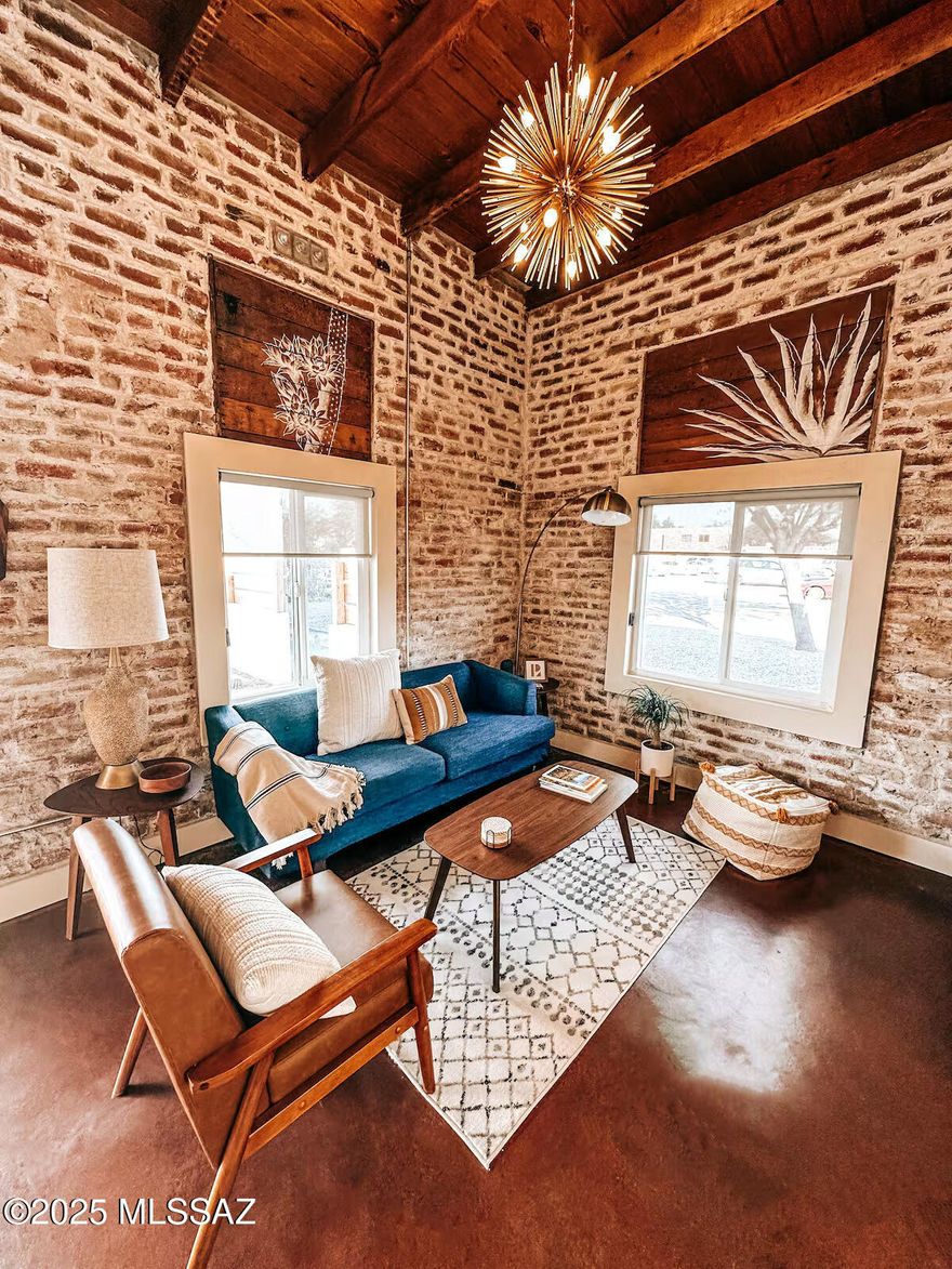 Experience the perfect blend of historic charm and modern luxury in this beautifully renovated home, thoughtfully reimagined with high-end finishes that celebrate the timeless beauty of the Southwest. Inspired by Tucson's rich heritage and the vibrant hues of the Sonoran Desert, every detail reflects a deep connection to place and tradition. Nestled in the heart of central Tucson near iconic Armory Park, this home offers unbeatable access--just minutes from Downtown Tucson, the University of Arizona, and some of the city's finest dining, shopping, and entertainment. Inside, you'll find an open-concept living space ideal for both relaxing and entertaining, along with a stunning, fully remodeled kitchen that seamlessly blends style and function. Step outside to a spacious backyard designed for gatherings under the desert sky, and enjoy the convenience of off-street parking. This is Tucson living at its best authentic, inspired, and move-in ready.