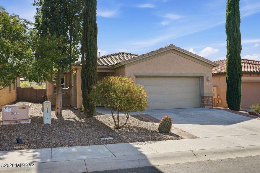The perfect lock-leave home w/potential of seller financing !! Experience refined desert living in this beautifully maintained residence nestled within the prestigious Dove Mountain community, located behind the gates of The Preserve. This elegantly updated home welcomes you w/ an expansive open great room that seamlessly blends into a gourmet chef's kitchen--featuring stainless steel appliances, granite countertops, a striking tiled backsplash & abundant cabinetry. Freshly painted interiors, complemented by crisp white shutters, create a bright, sophisticated ambiance thru-out. The luxurious primary suite offers a bathroom complete w/ an oversized walk-in shower, garden soaking tub. Thoughtful enhancements include neutral diagonal-set tile flooring, a 2-ft garage extension.
