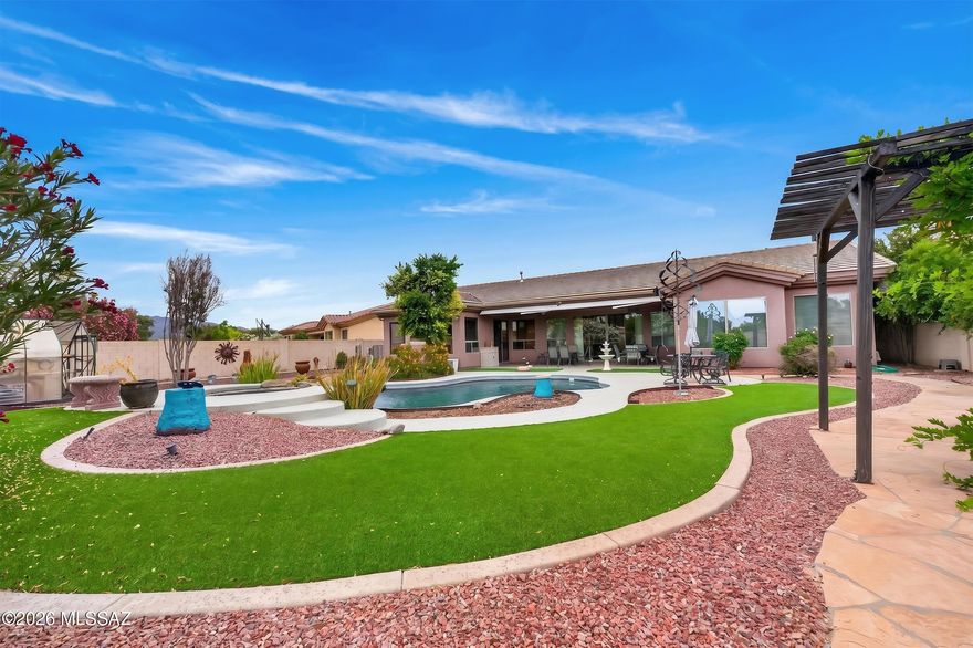 Located in the gated Lakes at Castle Rock community in the Tanque Verde Valley, this 4-bedroom, 3-bath home with a 3-car garage offers a comfortable blend of space, privacy, and outdoor living. The large front courtyard creates a welcoming first impression and feels like an extension of the home itself, a great spot for coffee in the morning or relaxing in the evening. Inside, the layout is functional and filled with natural light, with generous living spaces and a split-bedroom floor plan that gives everyone a little breathing room. Large windows across the back of the home bring the backyard into view and make the living areas feel open and connected. Out back is where this property really stands apart. The resort-style yard features a sparkling pool, mature landscaping, and multiple seating areas designed to be enjoyed--not just looked at. Whether it is hosting friends, grilling on the weekend, or winding down after a long day, this backyard was built for Arizona living. The greenhouse is another great bonus and adds flexibility for gardening, hobbies, or extra storage.
Beyond the home itself, The Lakes at Castle Rock is one of those communities people move into and tend to stay. Residents enjoy access to lakes, walking paths, pools, fitness amenities, tennis courts, and beautifully maintained grounds, all just minutes from shopping, restaurants, and everyday conveniences.
A well-cared-for home in one of the Tanque Verde area's most desirable gated communities.