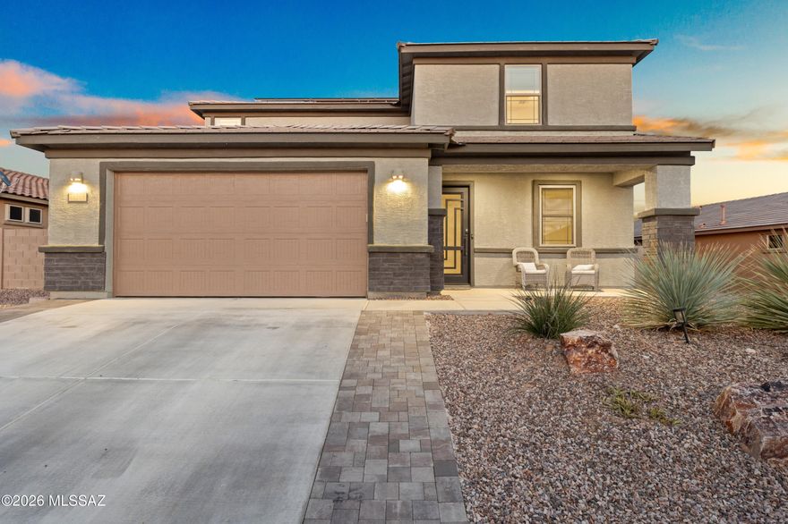Designed for multi-generational living, this energy-efficient home in a gated Oro Valley community offers 5 bedrooms, 3 bathrooms, and 2,860 sq. ft. on an oversized lot. The downstairs bedroom and full bath with private backyard patio access create the perfect setup for extended family or guests. A separate first-floor den/office adds flexibility. Spacious floor plan includes a large upstairs game room ideal for a second living area or media room. Chef's kitchen opens to the main living spaces for easy entertaining. Tandem 3-car garage and oversized backyard. Enjoy nearby walking trails, parks, and the one-acre dog park in Saguaros Viejos, nestled between the Catalina and Tortolita Mountains. You'll be hard-pressed to find a nicer Oro Valley home at this price!