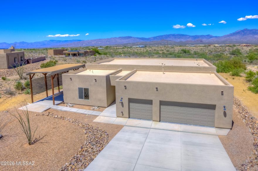 POOL PACKAGE AVAILABLE! Seller can install a brand-new custom pool for an additional $60,000 with estimated completion in approximately 2 months. Luxury desert living on over an acre in the desirable Sonoita Hills at Mountain View Ranch w/ panoramic views of the Rincons & the kind of privacy buyers covet. Located in the award-winning Vail School District this 4-bedroom, 3-bathroom home offers a peaceful setting w/ exceptional mountain views from throughout the home, a beautifully finished backyard w/ pavers, turf, & space designed for both entertaining & comfort. The landscaped front yard features upgraded drainage, while the insulated garage & quality insulation throughout the home creates a quiet, comfortable environment. Enjoy a large 3 car garage, covered RV parking & RV/boat gate while maintaining curb appeal. Thoughtfully designed inside & out, this home combines modern luxury w/ functionality, privacy, & breathtaking scenery. Motivated seller w/options available for permanent or temporary interest rate buy downs.