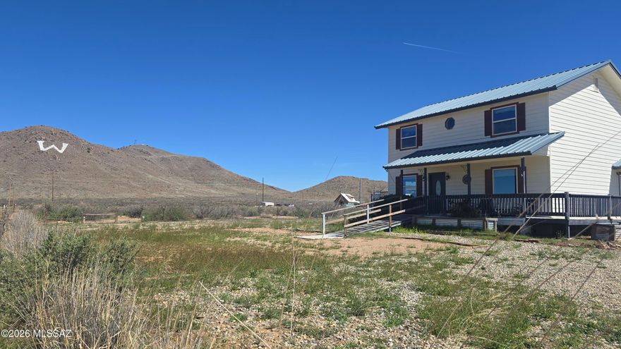 This 7-acre horse property in Willcox, Arizona offers an exceptional combination of space, practicality, and charm. The two-story home features 5 bedrooms and 3.5 baths, providing generous living space for family, guests, and multi-use needs, with bright, open living areas and a master suite that includes a private bath and ample closet space. A large metal workshop with dual roll-up doors adds outstanding value for projects, storage, and equipment, while a dedicated hay barn and established horse corrals cater to equestrian enthusiasts. The property's desert-ready exterior is low maintenance, and the horse-friendly layout includes secure paddocks and clean fencing to support riding, training, and boarding activities. Outside, you'll find fenced pastures, ample room for outdoor entertaining, gardening, and future expansion, all enhanced by tranquil desert views and privacy. A charming she shed provides a peaceful retreat or creative space. Located in a peaceful Willcox neighborhood with easy access to trails, wineries, and local amenities, this turnkey property is ideal for horse owners seeking room to grow, families needing flexible living space, and hobbyists who value a robust workshop and abundant acreage. Schedule your showing to experience all the possibilities this Willcox property offers.