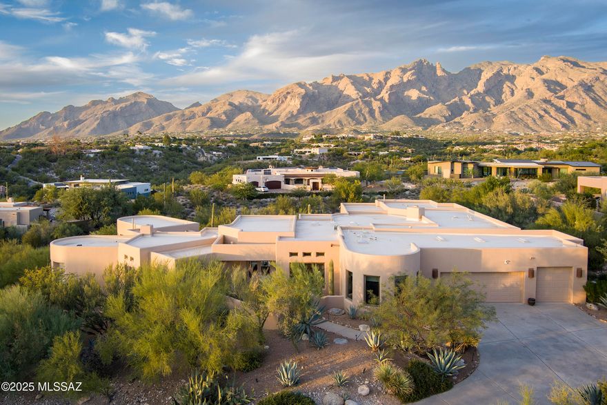 Impressive views inside & outside of this stunning home (designed by Ron Robinette) on an elevated corner lot on a cul de sac in gated Colonia de Sol. The unobstructed views of the surrounding mountains, the city lights, mesmerizing sunsets from the various, extensive, multilevel covered & uncovered patio areas with the privacy make for the ideal retreat or entertaining. The stunning main home has 5 bedrooms (each with it's own bath), an office & den. The primary bath was recently, beautifully remodeled & the primary bedroom has it's own patio with those views. The high ceiling, gourmet kitchen is open to the den & breakfast area. The expansive openness brings the outside in. And then, there is the guest house off the pool/spa area offset from the main house.