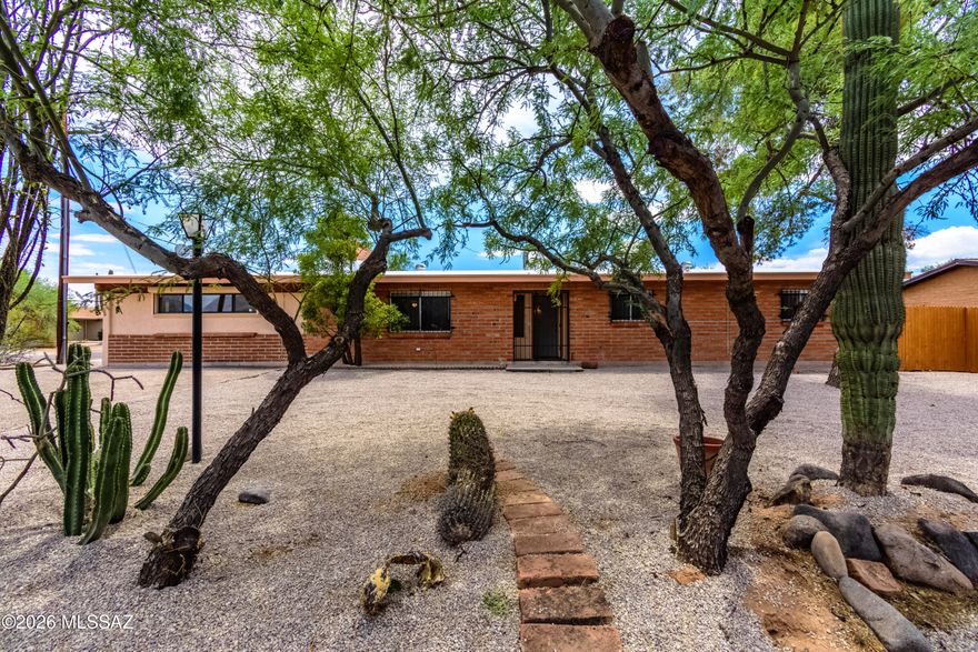 Welcome to this expansive 2,050sq ft adobe brick home conveniently located in central Tucson. Featuring multiple living areas, including an oversized great room with a second fireplace, this home offers ample space for entertaining, work-from-home, and hobby areas. Updated with modern luxury vinyl plank flooring, fresh finishes, and a remodeled kitchen with updated cabinetry and countertops. Spacious primary suite includes a walk in closet, while the updated bathrooms feature modern finishes and clean design. Large Laundry Room received the same treatment
Other features are Large covered patio for outdoor living. Oversized finished garage with upgraded flooring and lighting, and BONUS ROOM off garage, perfect for storage, workshop, gym, etc. A unique home with space, flexibility, and valu Welcome to this expansive 2,050sq ft brick home offering a rare combination of space, functionality, and modern updates conveniently located in central Tucson.
Designed with flexibility in mind, this home features multiple living areas, including an oversized great room with a second fireplace, ideal for entertaining, relaxing, or creating a custom living setup. The open layout provides endless possibilities for multi-generational living, work-from-home space, or hobby areas.
This home has been thoughtfully updated with modern wood-look luxury vinyl plank flooring, fresh finishes, and a clean, cohesive feel throughout. The remodeled kitchen offers updated cabinetry, contemporary countertops, and a practical layout that connects seamlessly to the main living areas.
The spacious primary suite includes a walk-in closet, while the updated bathrooms feature modern finishes and clean design.
Step outside to a large covered patio with classic burnt adobe brick construction--perfect for outdoor living and entertaining year-round.
The oversized, fully finished garage is a rare find, complete with upgraded flooring, recessed lighting, ample space for vehicles, storage, etc. bonus flex room off storage can serve your needs as office, workshop, home gym, or just extra storage space.
With its generous layout, unique flexibility, and central location close to shopping, dining, and amenities, this property offers incredible value and opportunity, A must-see for buyers looking for space, versatility, and functionality in one home.