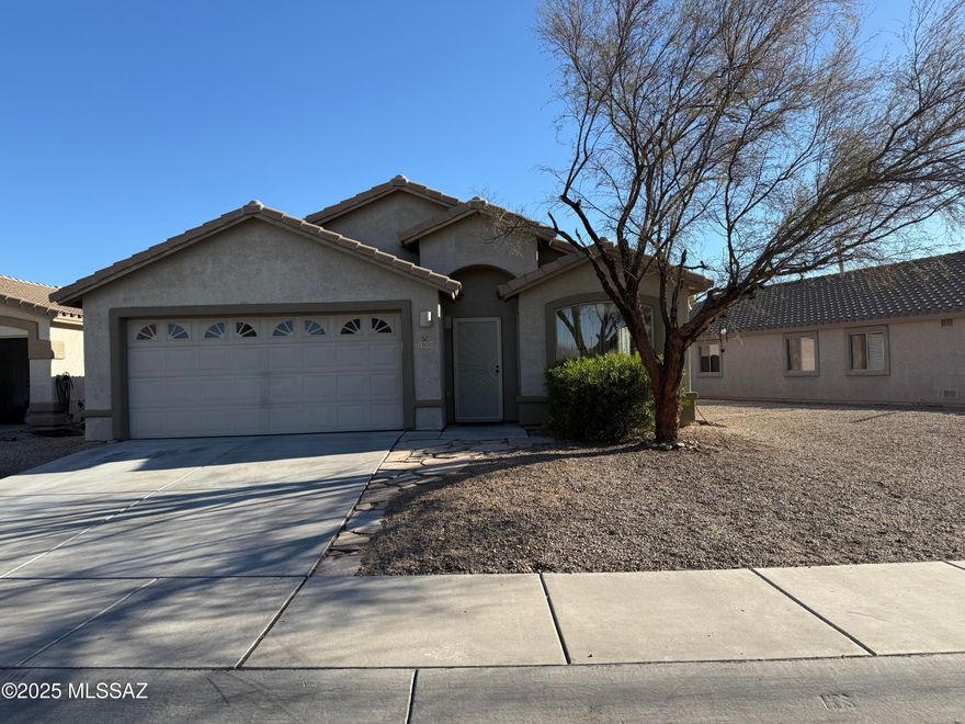 Spacious and Sparkling 4 Bedroom, 2 Bath Home in Move-in Condition!  Open Plan, High Ceilings, Formal Living and Dining plus Large Kitchen with Island, granite counter tops, Stainless Steel Appliances, and gas stove for the ultimate cook! Ceramic Tile Flooring in Living Areas, Carpet in Bedrooms. High ceilings, recessed lighting, ceiling fans, central air conditioning and central gas heat. Large Double Garage, and Walled Yard with turf and decorative rock off covered patio.  Adjacent to Dove Mountain Park featuring Tennis Courts, Volleyball Court, Kids Playground, and Dog Park.  This home is in Beautiful Condition!