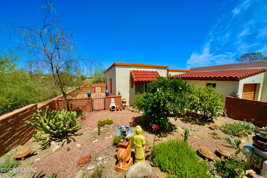 This updated 2 bed, 2 bath townhome blends Southwest charm with modern updates for comfort & style. A lush, welcoming garden sets the tone, creating a peaceful entry & outdoor retreat, while the wraparound patio offers space to relax & take in sweeping desert vistas & mountain views. Elevated positioning backs to wooded desert with open skies, added privacy & no rear neighbors. Inside, tile flooring provides a clean, cohesive feel. The Arizona room opens to the living area, adding approx 252 sq ft of flexible space for a studio or additional living. Roof recoated in 2024 & HVAC replaced in 2022.