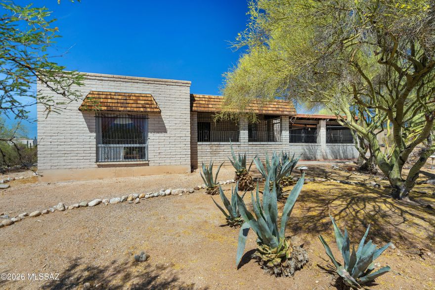 PRICE REDUCED! Charming Oracle Foothills Estate on .829 acre lot. Slump block ranch home offers NO HOA and room for all your toys. 3 bedrooms, 2 bathrooms, and 2,228 sq ft with a 2-car attached garage. Home offering privacy and mountain views. The living room at the front of the house and the family room off the back give you two large living spaces.  Formal dining room, too.  Home features a bonus room perfect for an extra bedroom, home office or storage. The primary bedroom features a private bathroom.  Backyard has a patio, a view of the mountains, and a fully fenced yard. Lots of parking, and RV parking is okay here.  Close to shopping, schools, and everything you need due to its close location to La Canada. NO HOA! Come make this home your own!