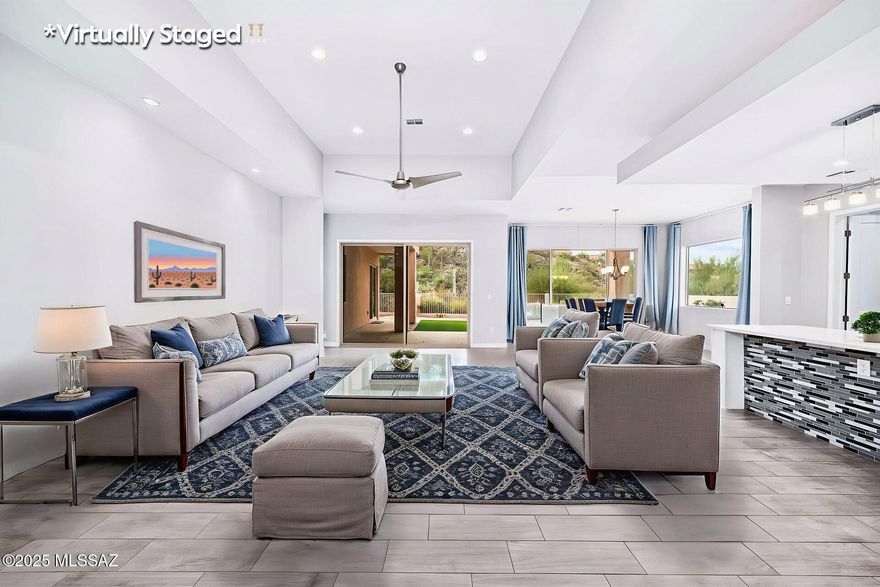 Welcome to this modern single-story home in the highly desirable gated La Reserve community. Built just six years ago, this well-maintained home offers 3 bedrooms, a den, and 2.5 bathrooms with timeless upgrades throughout.
The open floor plan features soaring ceilings, quartz countertops, and bright living spaces perfect for everyday living and entertaining. The roof was resurfaced in February 2025, and the HVAC system is on a biannual maintenance plan.
Enjoy beautiful city and mountain views from the backyard while relaxing in the hot tub (conveys as-is). Conveniently located near Basis Oro Valley, shopping, and dining. Home warranty in place through August 2026. Owner/Agent.