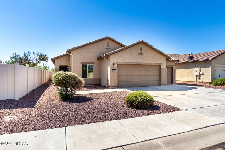 Discover the perfect blend of comfort and convenience in this single-story home located in the beautiful and affordable Red Rock Village. This 3-bedroom, 2-bathroom home, with an additional den, has been meticulously maintained and thoughtfully updated to meet modern tastes. Step inside to find a contemporary layout featuring light-colored wood plank tile floors throughout! The expansive kitchen stands out with its abundant storage and counter space, offering a practicality that many new homes simply can't match. The well-proportioned living areas flow seamlessly into a 0, ideal for outdoor relaxation and entertainment. The owner's suite features dual closets and a spacious layout. The home is equipped with leased solar. Come and check it out!