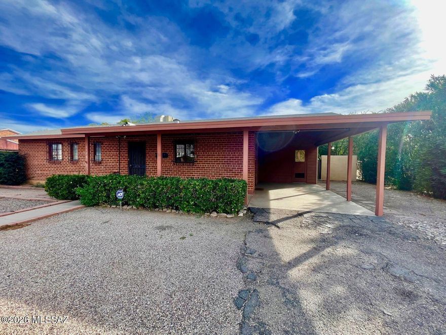 Ideal Central Location! Just one mile from UofA, minutes from Banner Medical Center and the Campbell Corridor. This well built brick home offers 1563 sq ft with 3 bedrooms, 1 1/2 baths PLUS a charming guest house with a full kitchen, full bath & it's own private entrance & yard - perfect for rental income, multigenerational living, home office or visiting guests. The main house & guest house have 18'' tile floors throughout. Separate laundry/storage room adds convenience for both units. Situated on an extra deep lot the backyard features a Ramada w/ plenty of room to entertain or garden. The lot offers an additional rear space w/ potential to build another guest house (buyer to verify). Ideal for homeowners, parents of UofA students, medical staff, or investors. New HVAC July 2025 2025