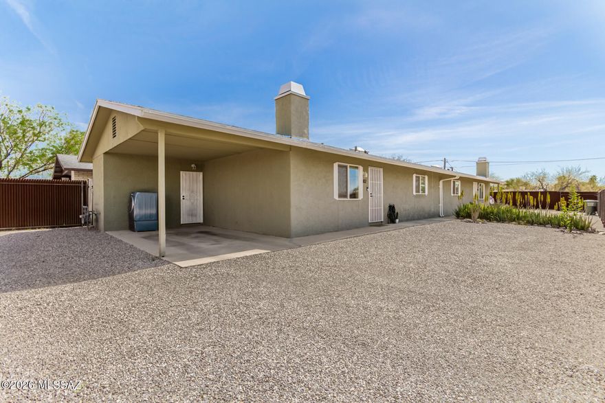 Take advantage of this fantastic investment opportunity! Live in one and continue to rent out the other, or rent out both! Each unit is separately metered. Become the proud owner of this fully-fenced corner lot with a 4-bedroom duplex. Each unit has 2 bedrooms, 1 bathroom and a full laundry room. It's also equipped with a serene living room with recessed lighting, a soothing palette, and a fireplace for cozy evenings. Both kitchens include quartz counters, ample cabinetry, stainless steel appliances, and a pantry for storing culinary essentials. All bedrooms are well-sized with custom closets, ensuring a private retreat for all inhabitants. Outside, you'll find carports for secure parking and plenty of space for outdoor relaxation. Each unit has their own yard as well. Don't miss out!