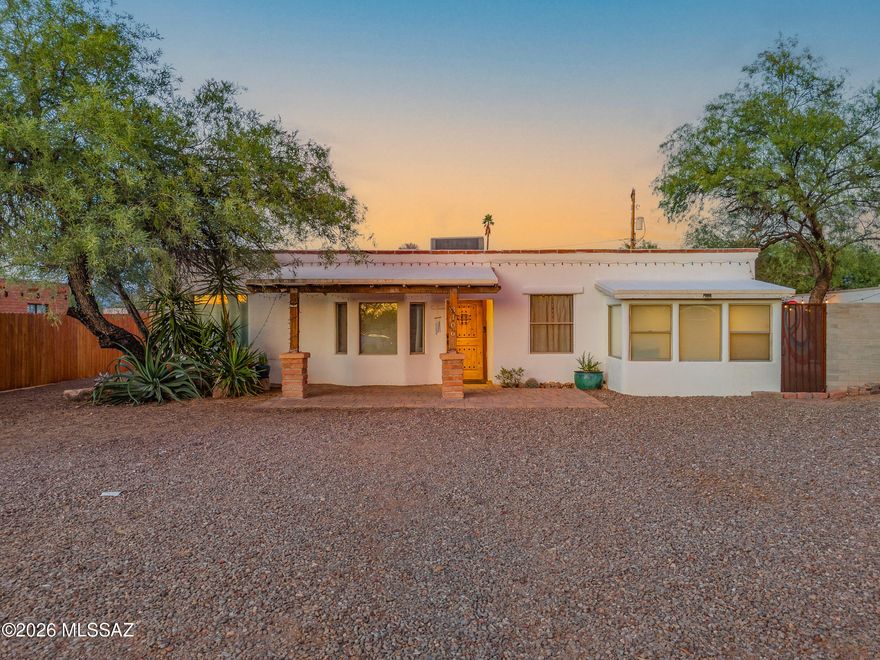 3108 N Tyndall being sold as well MLS # 22612213. Charming Central Tucson retreat featuring 3 bedrooms, 2 bathrooms, and a beautifully updated interior filled with character and style. The remodeled kitchen showcases sleek cabinetry, stainless steel appliances, skylights, open shelving, and generous counter space that flows into spacious living and dining areas with warm wood accents and modern finishes throughout. Situated on an oversized lot, the huge backyard is ideal for entertaining with string lights, colorful mural walls, mature trees, fire pit area, and endless room to relax or play. Detached garage offers flexible storage, workshop, or studio potential. Conveniently located near dining, shopping, parks, and the University area, this unique property blends Tucson charm with modern comfort and exceptional indoor-outdoor living.