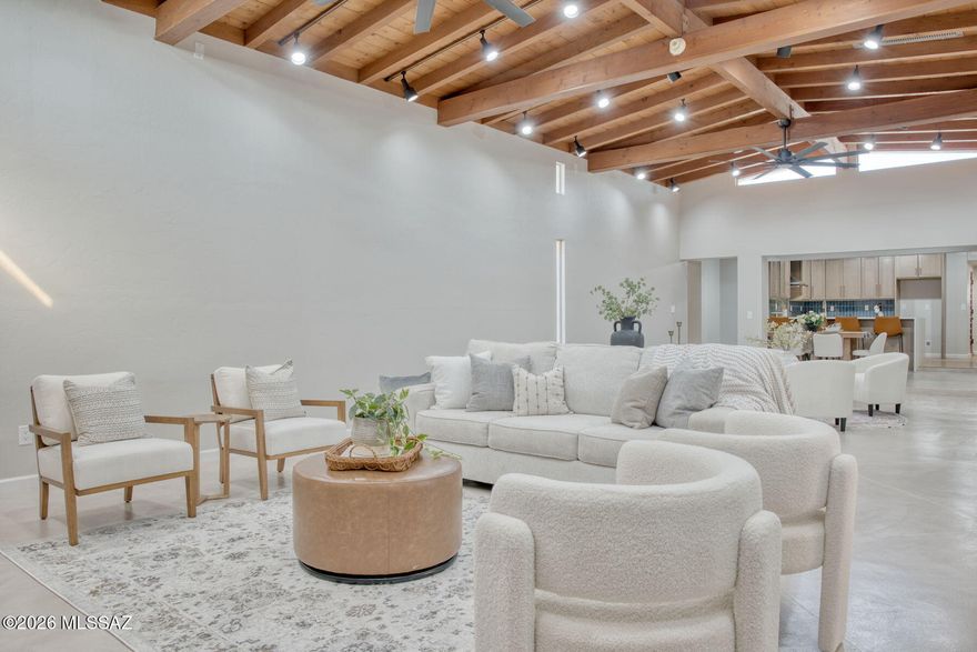 Range priced $575,000-$600,000. Seller will entertain offers within the range. Stunningly redesigned home in the historic San Clemente subdivision! Built in 1948, this elegant residence blends timeless charm with modern upgrades. Classic wood-beamed ceilings, rich wood floors, and an open remodeled kitchen with quartz counters set the stage. Custom concrete floors add character, while soaring ceilings and art-worthy spaces make this an entertainer's dream. Featuring 4 bedrooms plus an office, and 2 spa-inspired bathrooms, this rare find offers warmth, style, and function. Don't miss the large Arizona room! Perfectly located near Park Place, El Con, and Randolph Park. Covered RV parking! A true gem you won't want to miss! Seller is a licensed Arizona real estate agent.