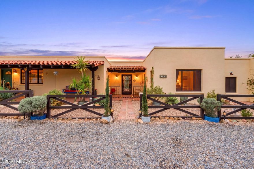 Nestled on over 4 acres of lush Sonoran Desert with stunning mountain views, this beautifully maintained hacienda-style estate offers the perfect blend of luxury and functionality for ranch or horse property living. Built with superior ICF construction, the home features a flexible 4-bedroom or 3-bedroom plus office layout, 3 full baths plus a powder room, including a private en-suite guest room. Custom upgrades throughout include Pella windows, solid wood doors, stained concrete floors, hand-painted tile, dual copper kitchen sinks, pot filler, gas cooktop, and stainless steel appliances. Outdoor amenities shine with a heated custom pool, private pickleball court, labyrinth outdoor kitchen/BBQ, covered patios, professional landscaping, exterior lighting, RV hookups with parking pad, & more