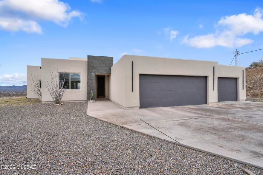 Panoramic Mountain Views! Enjoy the serenity of being surrounded by Arizona sky and desert landscape in this unique custom home. Open-concept floor plan features 4 bedrooms 3 bathrooms, two tone kitchen cabinetry, granite countertops, custom light fixtures, custom vanities and much more. The Master bedroom features an ensuite with a free standing bathtub and a large walk in shower. Room for RV parking and plenty of outdoor space for entertaining or just enjoying the most beautiful sunsets Arizona has to offer. Call for a private showing today!