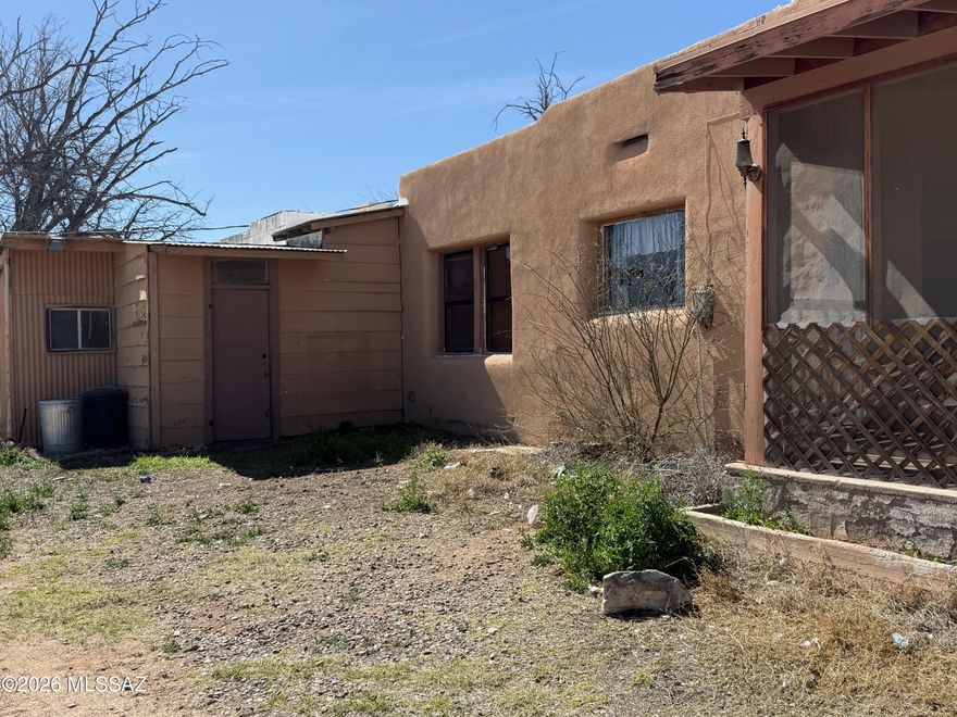4 acres to be split from parcel ID # 124-41-002 prior to closing with an old adobe house built in 1941 in need of major renovation. Electric is on and there is a well share to be included. This is a nice flat useable parcel on a paved road close to Benson for shopping with room for horses or whatever your needs are. Check out the property's potential and make an offer. House is being sold As Is. Where Is.