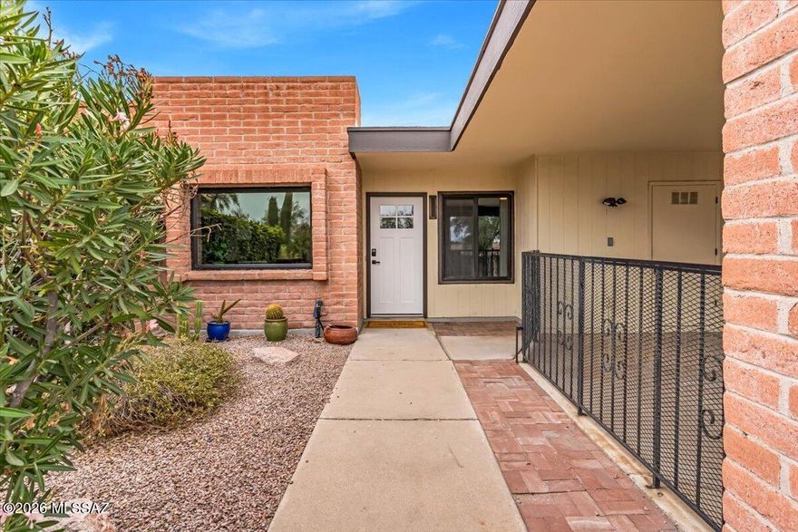 Foothills Townhome with Stunning Catalina Mountain Views! Located in Tucson's highly sought-after District 16, this beautifully updated 1,607 sq. ft. residence offers 3 bedrooms and 2 bathrooms.
The spacious living room features a cozy wood-burning fireplace and breathtaking Catalina Mountain views, creating the perfect space to relax or entertain. The primary suite opens to a private, walled patio for added comfort and privacy.
Enjoy a charming front brick courtyard, an eat-in kitchen with ample cabinetry, and additional storage off both the back patio and covered carport.
The HOA covers water, sewer, trash, pool, spa, tennis courts, recreation center, roof repair, exterior maintenance, and front landscaping offering a low-maintenance lifestyle.Owner is licensed to sell in the state of
