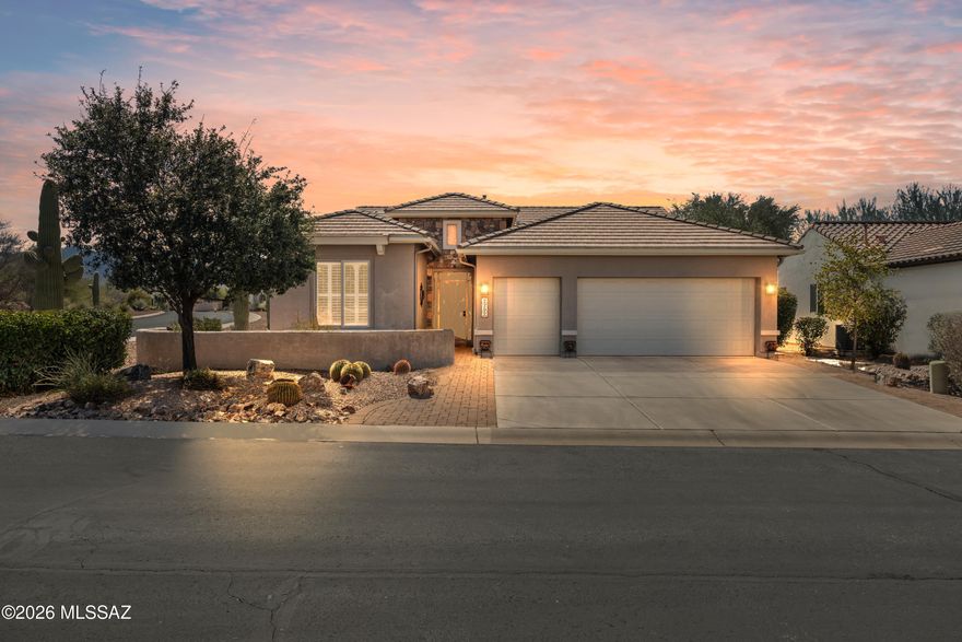 Located in the beautiful, active adult lifestyle community of Quail Creek Country Club, this elegantly appointed Newport model offers quality upgrades throughout. Featuring 2 bedrooms, 2 full bathrooms, a versatile den, and a golf cart garage, this home is perfectly designed for Arizona-style living. Situated on a desirable corner lot, the property captures stunning southern mountain views while providing exceptional privacy.
The curved foyer entryway creates an elegant first impression and sets the tone for the home's refined finishes. From the moment you enter, you'll appreciate the spacious great room design. An expansive, open living area seamlessly connected to the kitchen. The great room includes a built-in entertainment center with cherry wood cabinetry, granite countertops, and surround sound speakers, making it ideal for both relaxing and entertaining.
Throughout the home, custom window treatments, professional paint and stylish details with an artistic Southwest flair create a warm, inviting feel. The kitchen features cherry cabinetry, granite counters, and a gas range, along with a bright dining area highlighted by a large bay window that fills the home with natural light and adds additional usable space.
The well-appointed den showcases custom built-in cherry desk cabinetry and shelving, along with a Murphy bed, offering excellent flexibility as a home office or guest retreat.
The primary suite is a peaceful sanctuary, complete with a large bay window, executive-height double vanity, tile shower, and a spacious walk-in closet.
Outdoor living is just as impressive, with multiple spaces designed for enjoyment and entertainment. Relax in the courtyard or the expansive, private backyard patio. The backyard area features a built-in grill, fire pit, and an electronic extended patio cover with LED lighting, providing comfort and ambiance year-round while showcasing breathtaking southern mountain views.
The extended garage offers exceptional functionality with a golf cart garage, built-in cabinetry, a 4-foot extension, upgraded insulation, and epoxy flooring  creating added storage and durability.
Major systems have been well maintained, including an HVAC system and hot water heater with recirculating pump that are approximately five years old, along with a two-year-old water softener and garage door opener.
Quail Creek is a vibrant active adult community where residents can enjoy an engaging retirement lifestyle or continue working while surrounded by beautiful scenery, exceptional amenities, and a welcoming neighborhood atmosphere.
